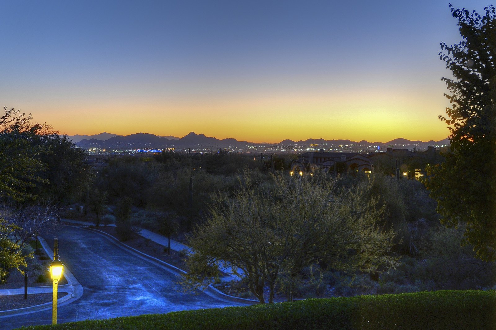 Scottsdale city lights at twilight, viewed from an elevated hillside estate