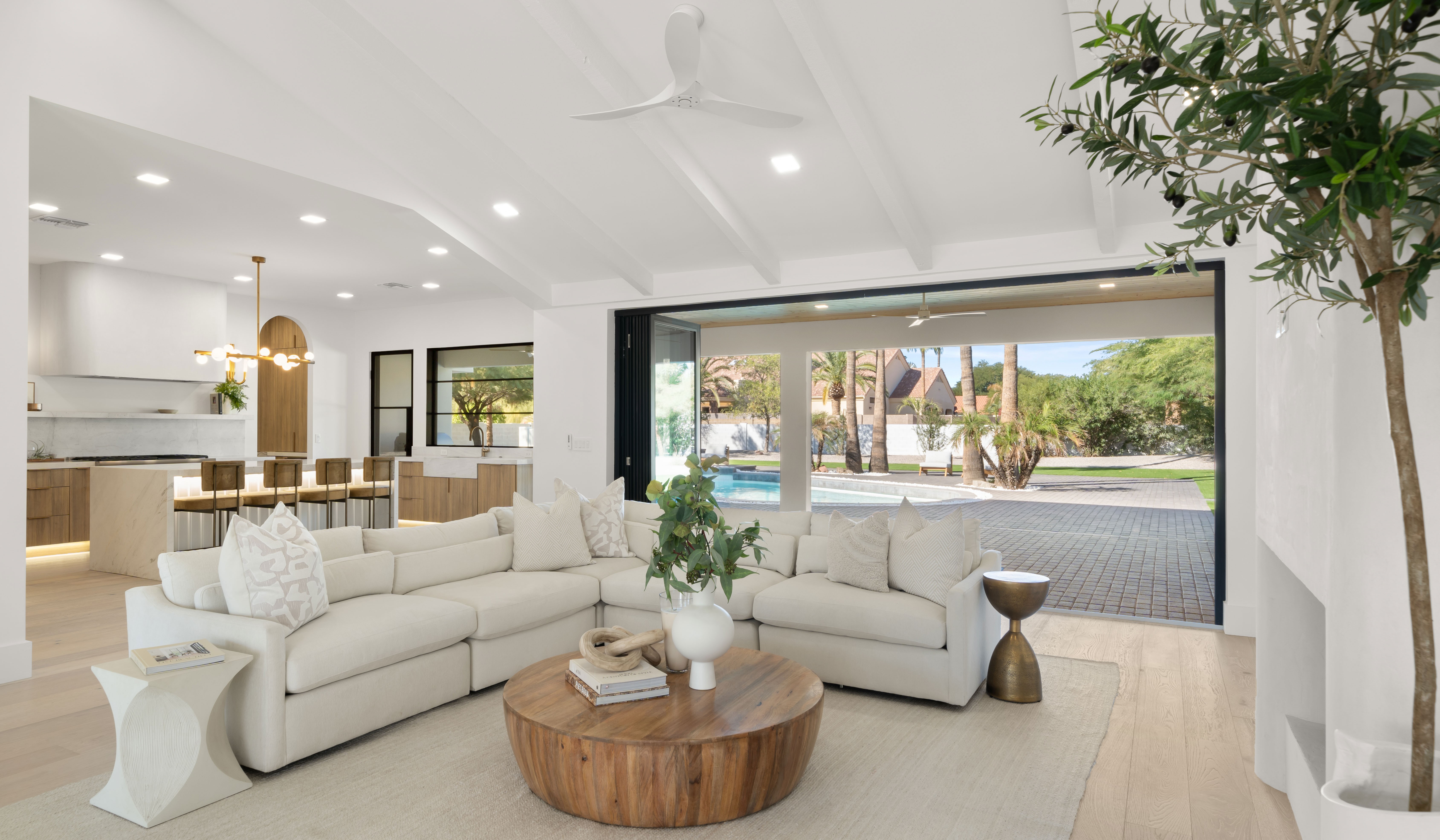 Open-concept great room opening to the pool patio in a Shea Corridor home